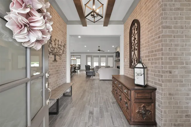 a view of living room kitchen and entryway