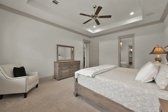 a bedroom with a bed and a couch