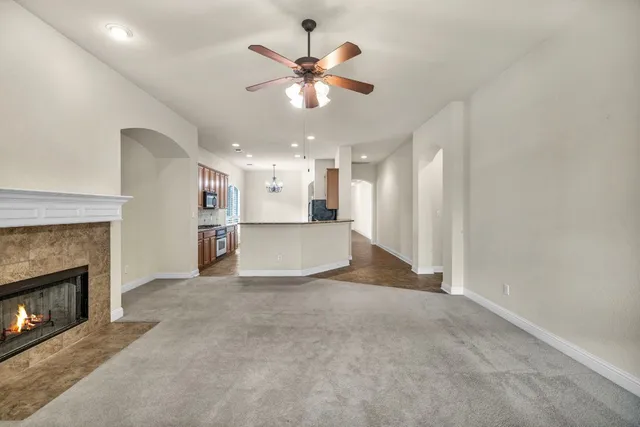 a view of an empty room with a fireplace