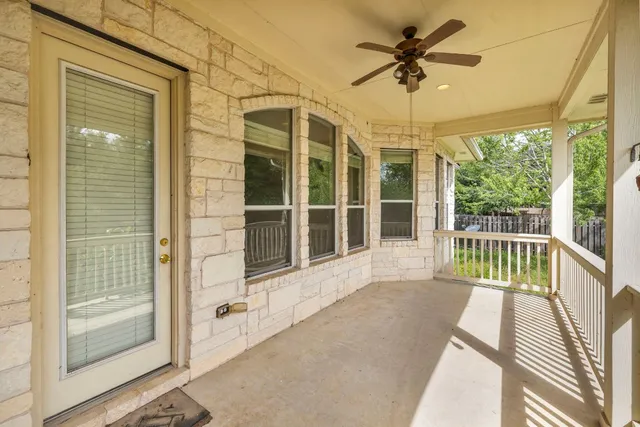 a view of a balcony with a potted plant