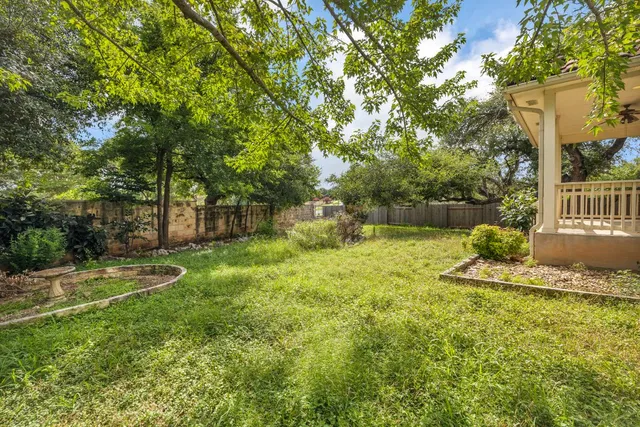 a backyard of a house with lots of green space