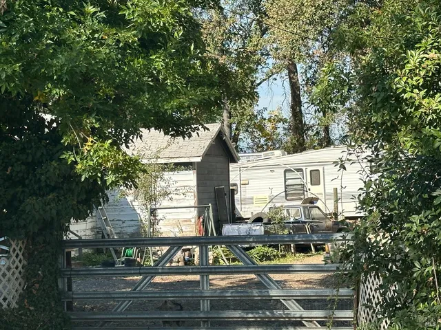 a front view of a residential apartment building with a yard