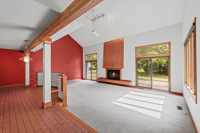 a livingroom with furniture and a fireplace