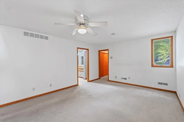 a view of an empty room with stairs