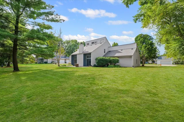 a front view of house with garden