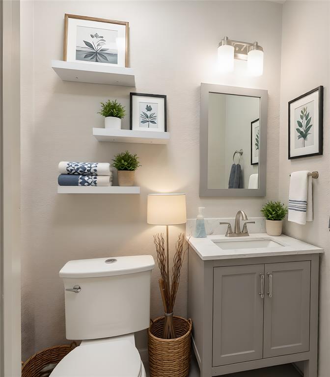 13 Crestview Circle Rockwall, TX 75087 - Photo 20 of 37 a bathroom with a toilet sink and mirror