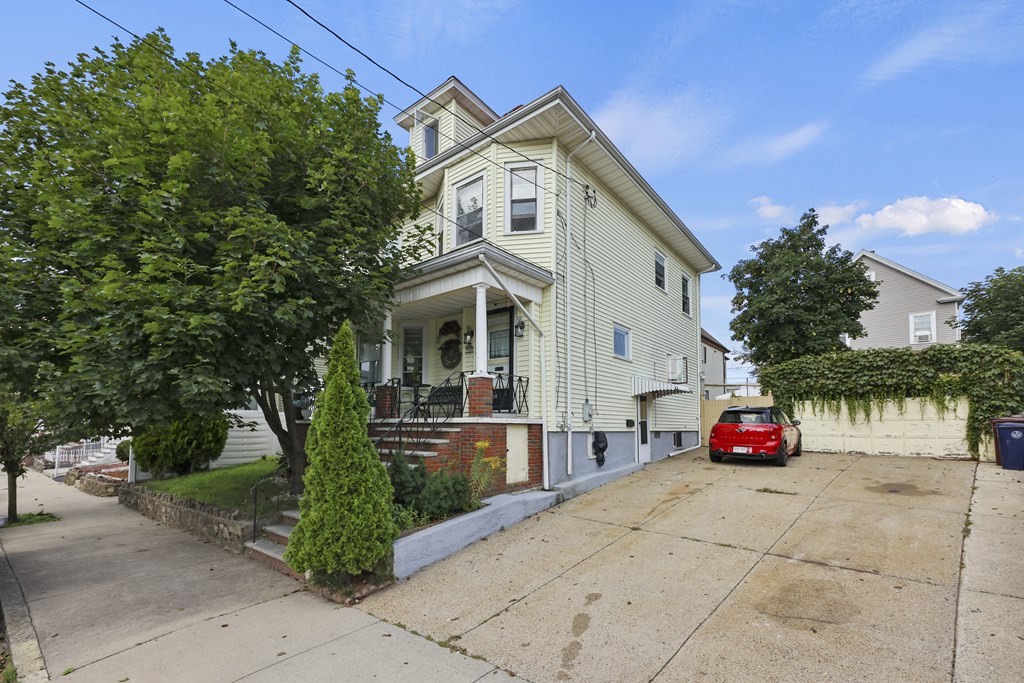 60 Baker Road Everett, MA 02149 - Photo 1 of 27 a front view of a house with garden