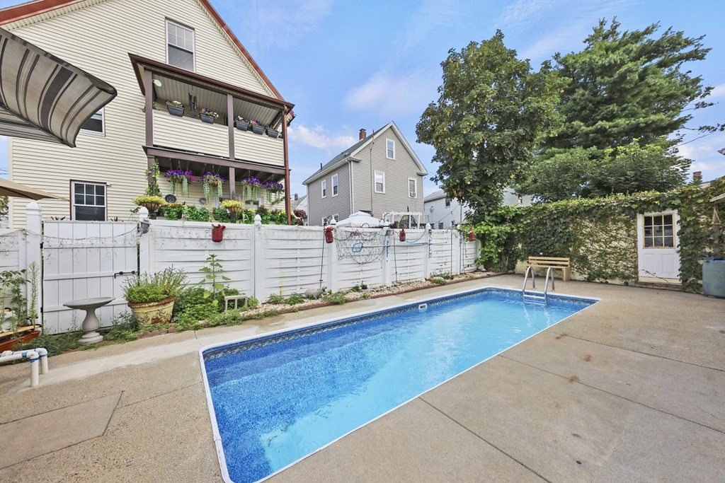 60 Baker Road Everett, MA 02149 - Photo 23 of 27 a view of a house with pool and sitting area