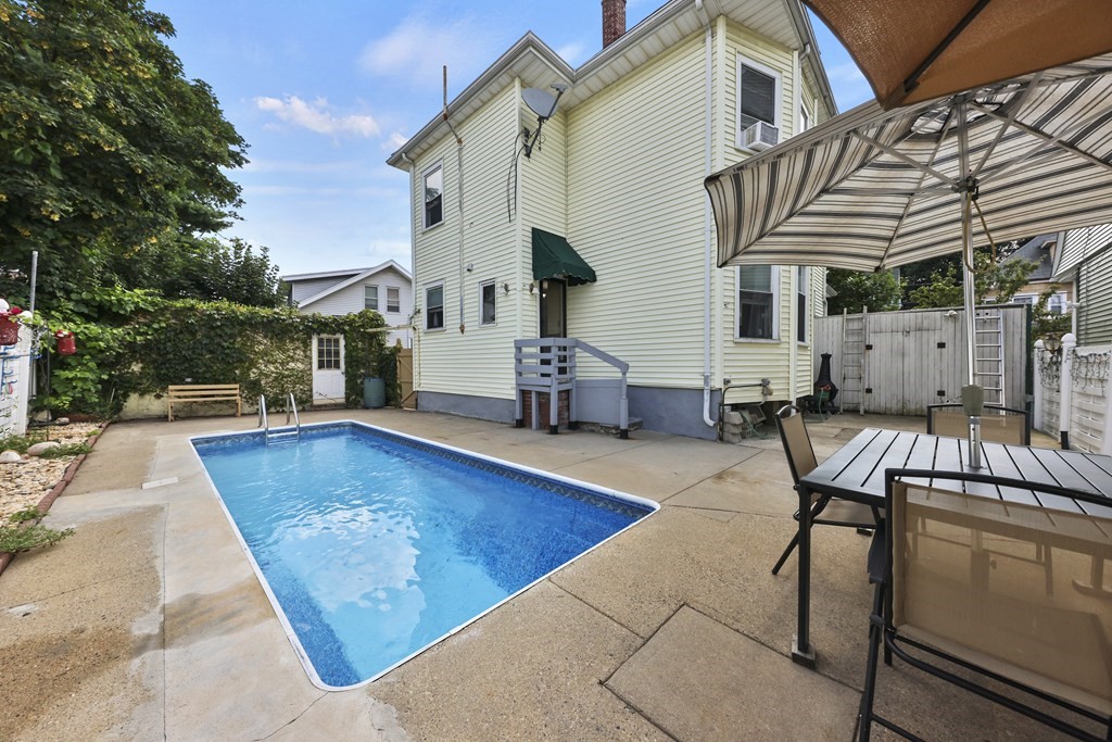 60 Baker Road Everett, MA 02149 - Photo 24 of 27 a view of a patio with swimming pool table and chairs