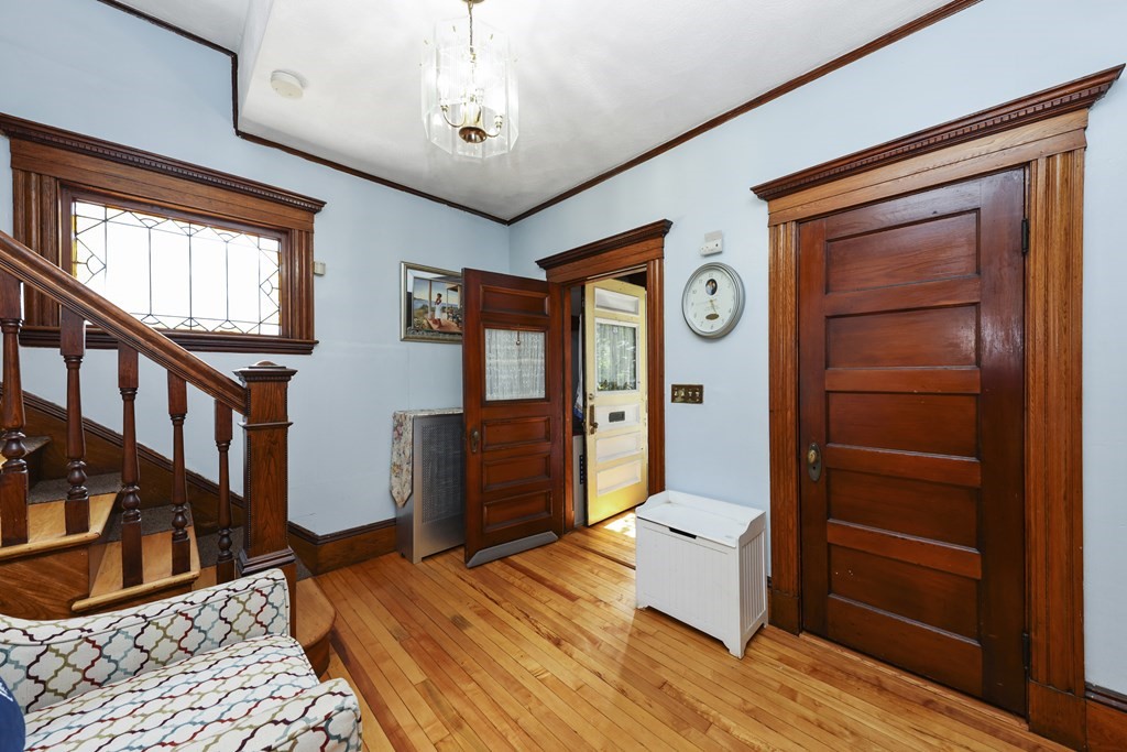 60 Baker Road Everett, MA 02149 - Photo 3 of 27 a bedroom with furniture and a window