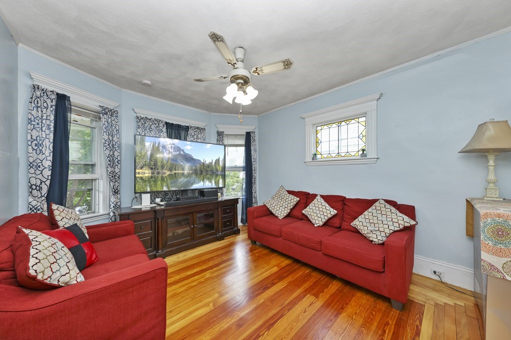 60 Baker Road Everett, MA 02149 - Photo 5 of 27 a living room with furniture and a large window
