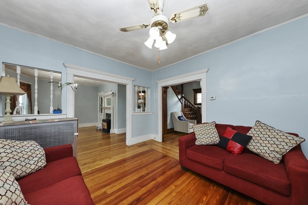 60 Baker Road Everett, MA 02149 - Photo 6 of 27 a living room with furniture and wooden floor