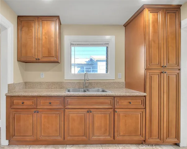 a kitchen with a stove and a refrigerator