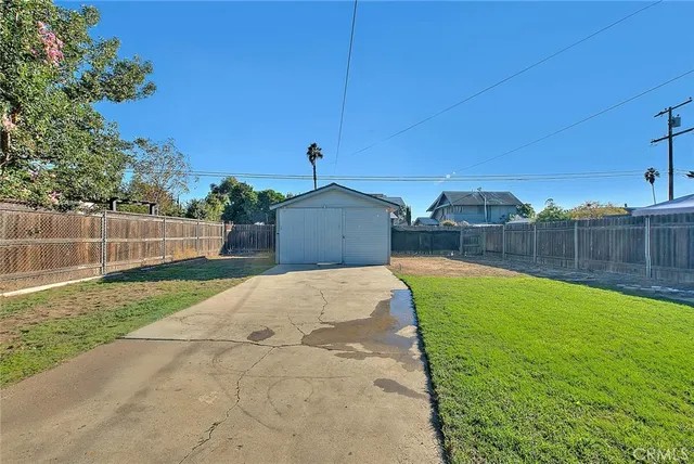 an aerial view of a house with outdoor space