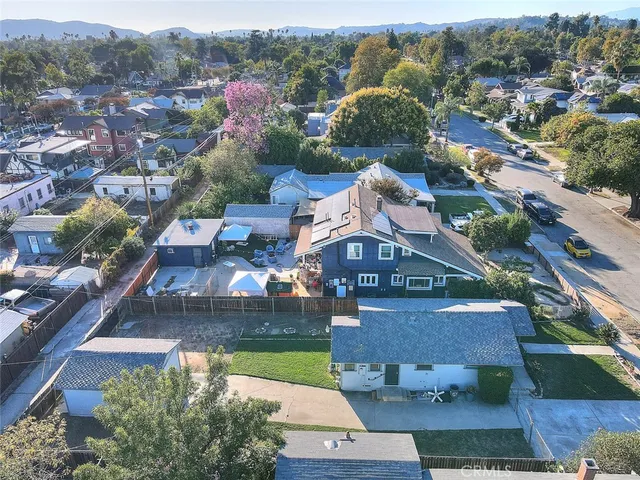 a aerial view of a house with a yard