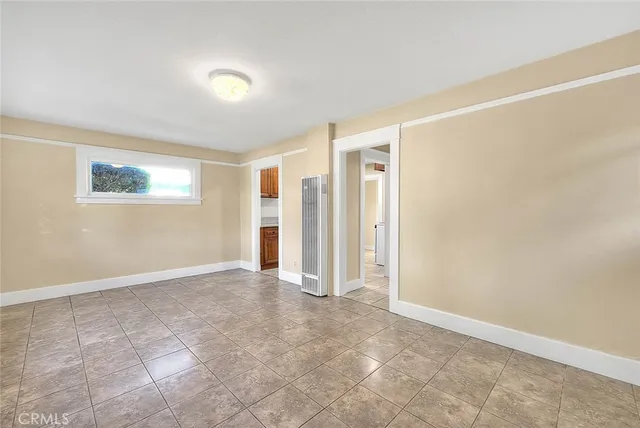 a kitchen with granite countertop a sink cabinets and stainless steel appliances
