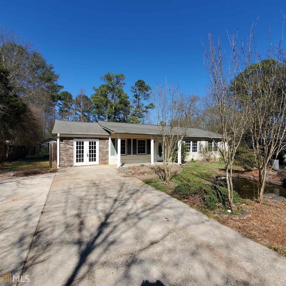 1548 Flat Rock Road Stockbridge, GA 30281 - Photo 1 of 1 a front view of a house with a garden
