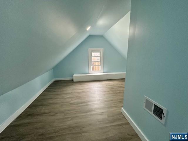 10 Arthur Street, Unit 2 Clifton, NJ 07011 - Photo 4 of 9 a view of a hallway with wooden floor and a window