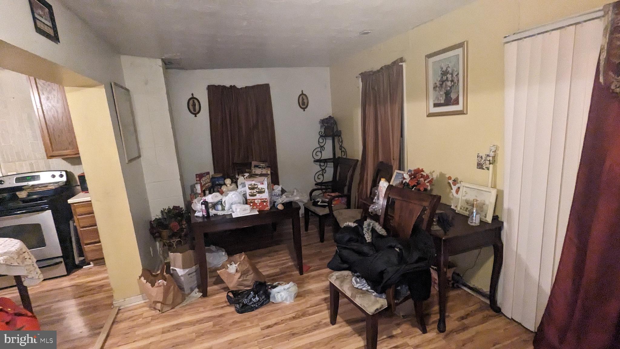 6740 Solomons Island Road North Owings, MD 20736 - Photo 15 of 58 a view of a dining room with furniture and wooden floor