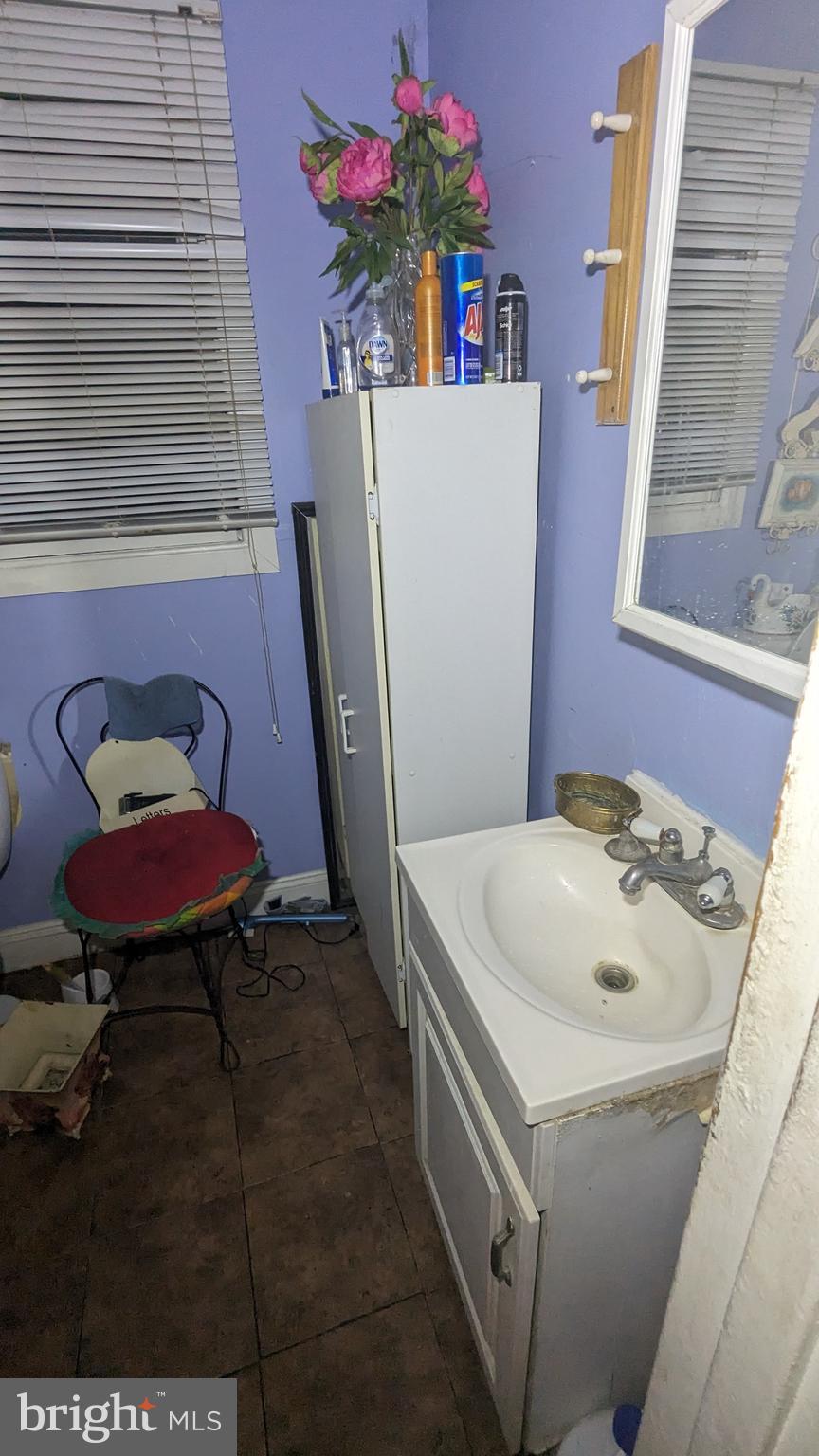 6740 Solomons Island Road North Owings, MD 20736 - Photo 19 of 58 a bathroom with a sink and a mirror