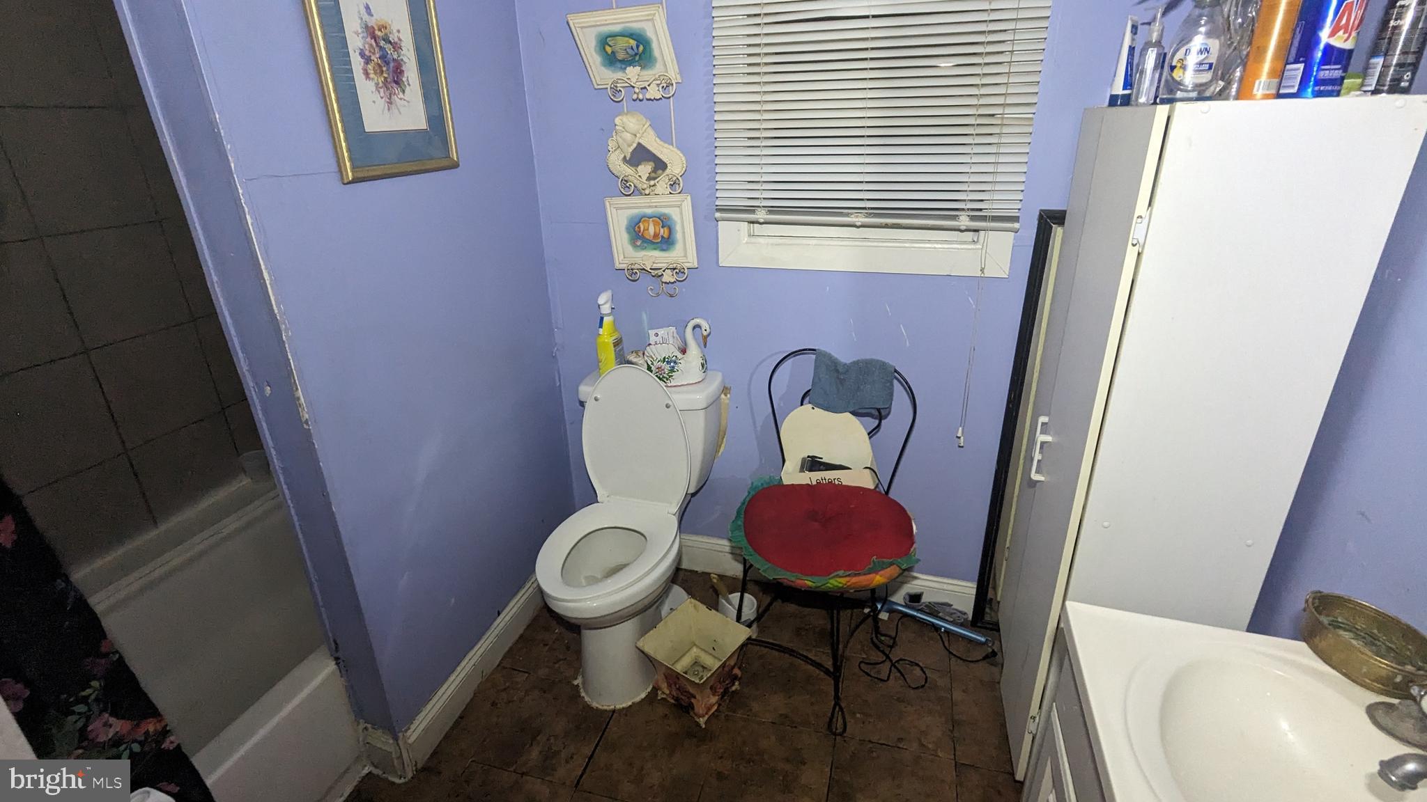 6740 Solomons Island Road North Owings, MD 20736 - Photo 22 of 58 a bathroom with a sink a toilet and a window