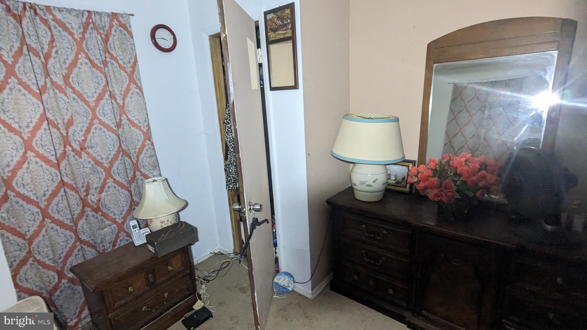 6740 Solomons Island Road North Owings, MD 20736 - Photo 29 of 58 a living room with furniture and a mirror