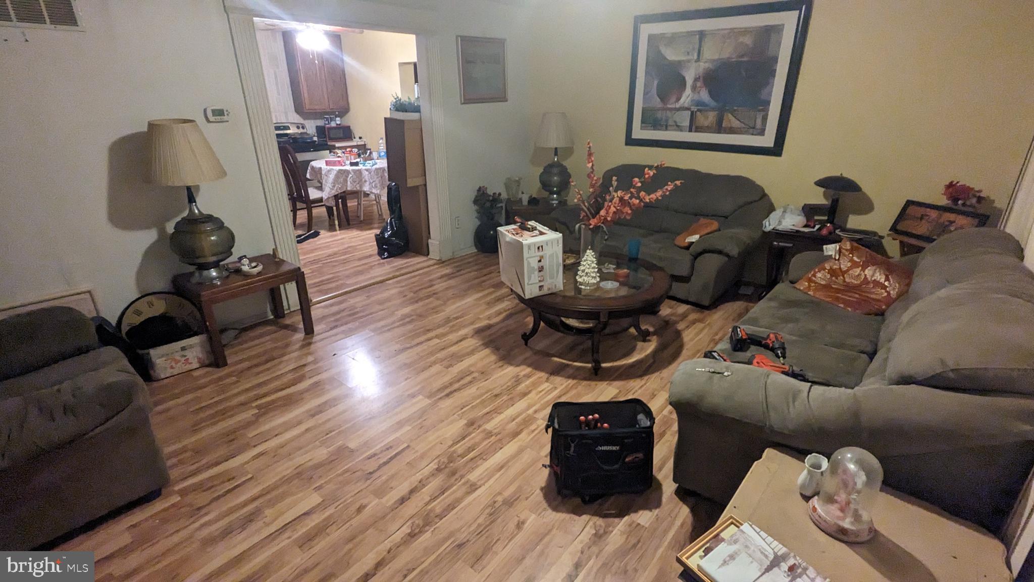 6740 Solomons Island Road North Owings, MD 20736 - Photo 9 of 58 a living room with furniture and wooden floor