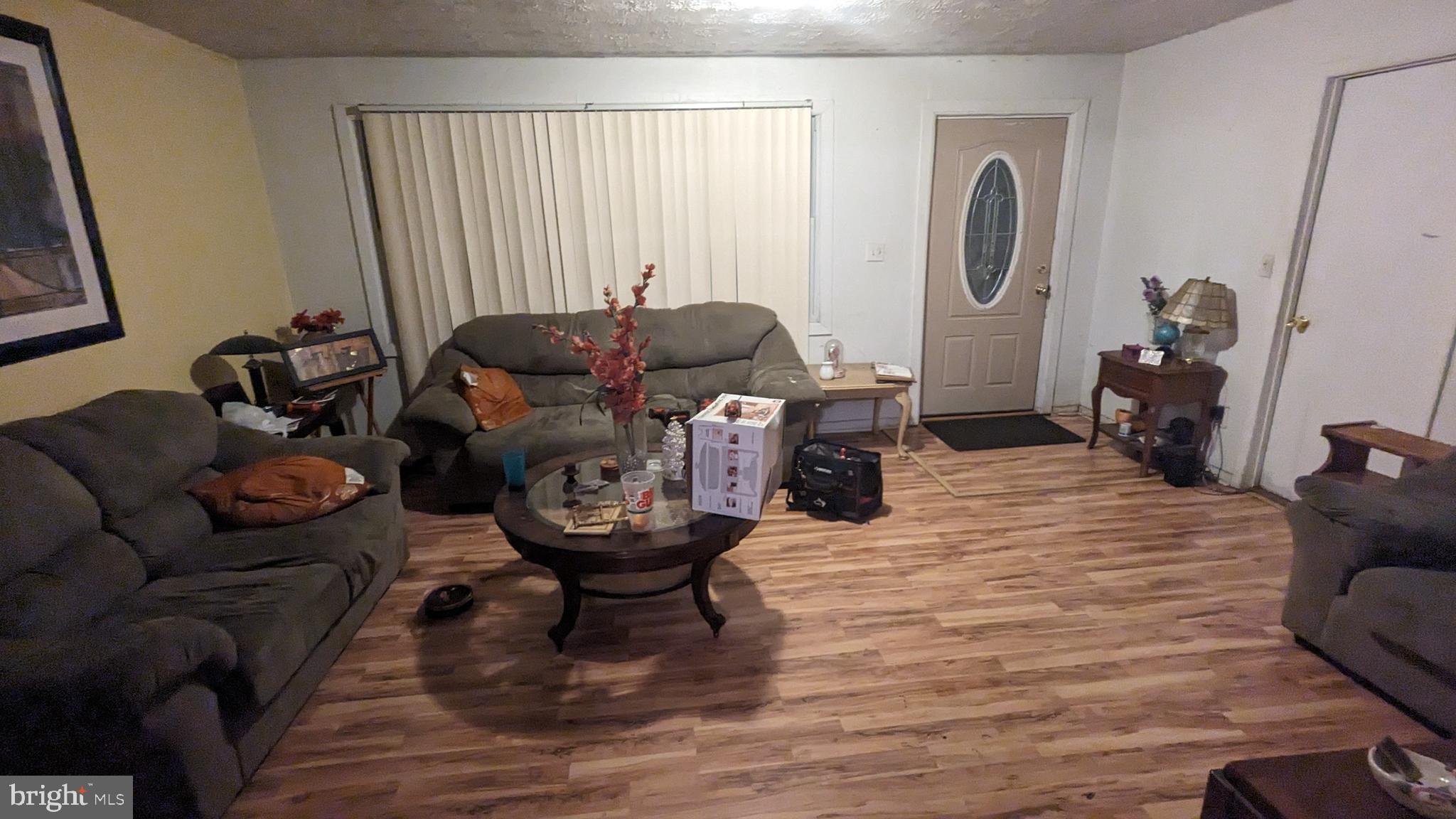 6740 Solomons Island Road North Owings, MD 20736 - Photo 10 of 58 a living room with furniture and a window