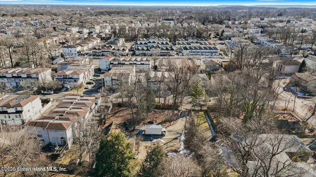 an aerial view of residential building with parking space