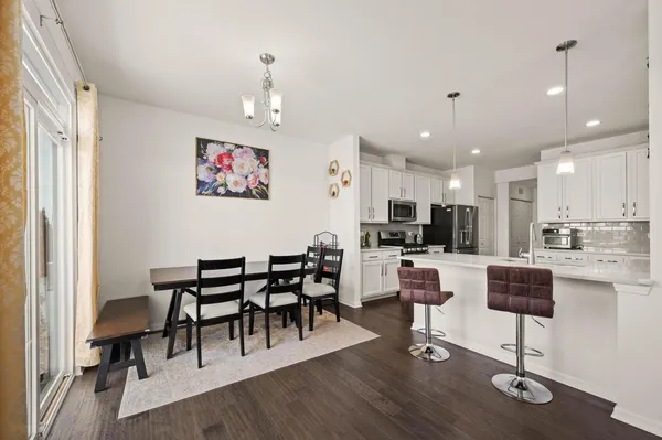 a view of kitchen with cabinets and wooden floor