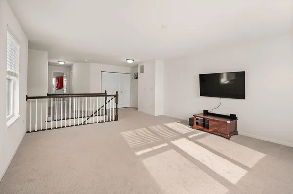 a view of a livingroom with furniture and wooden floor