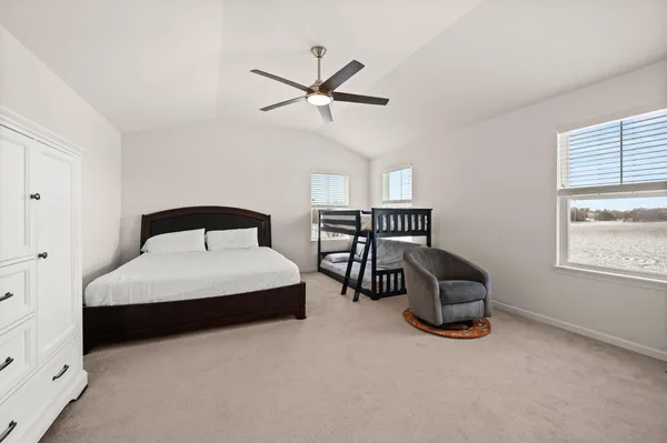 a bedroom with furniture and a window