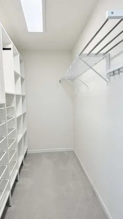 a view of a room with shelf on the wall