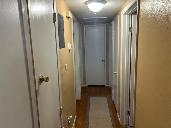 a bathroom with a sink toilet and mirror
