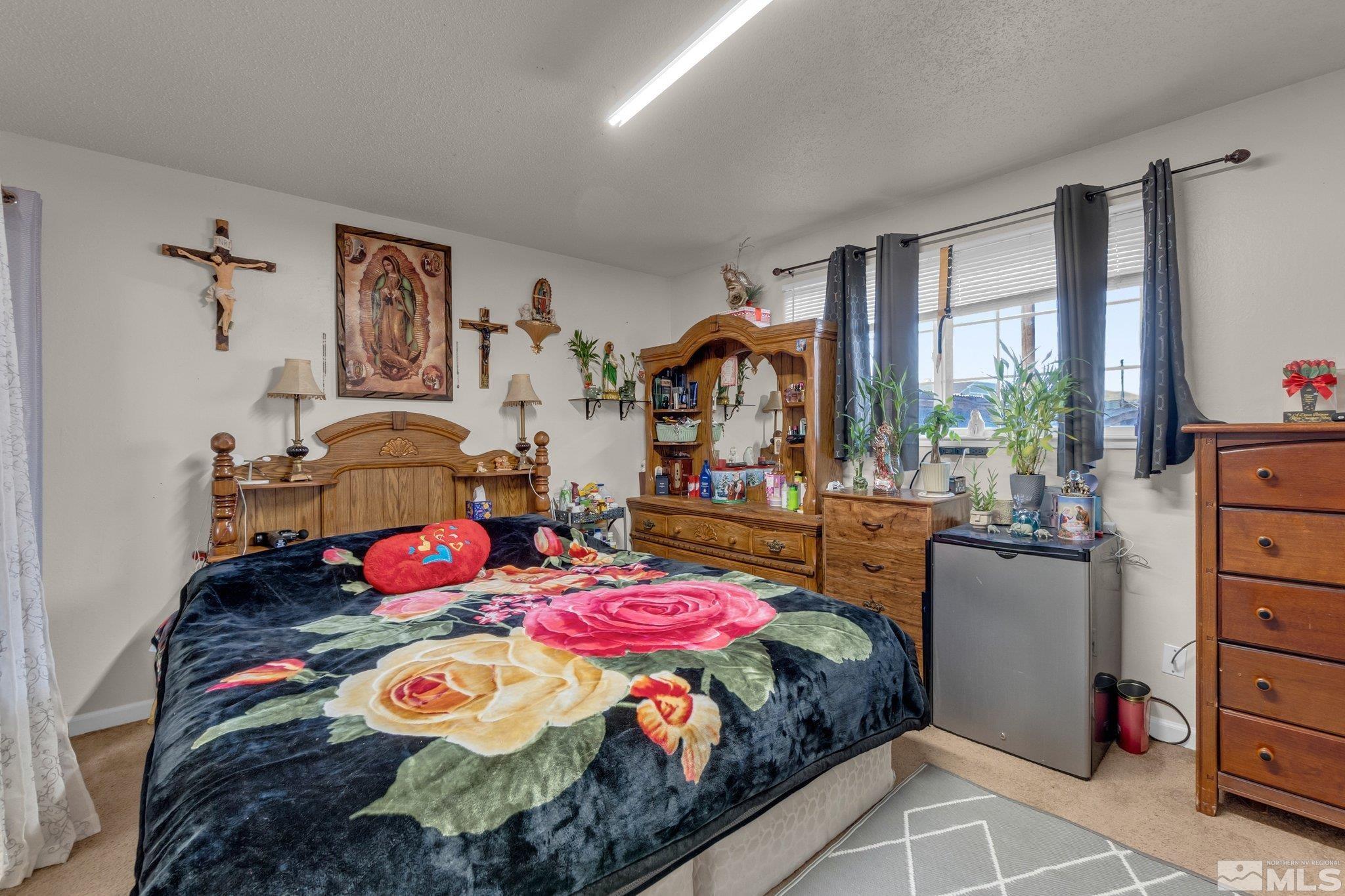 2265 Mannington Street Reno, NV 89512 - Photo 11 of 25 a bedroom with a bed and large windows