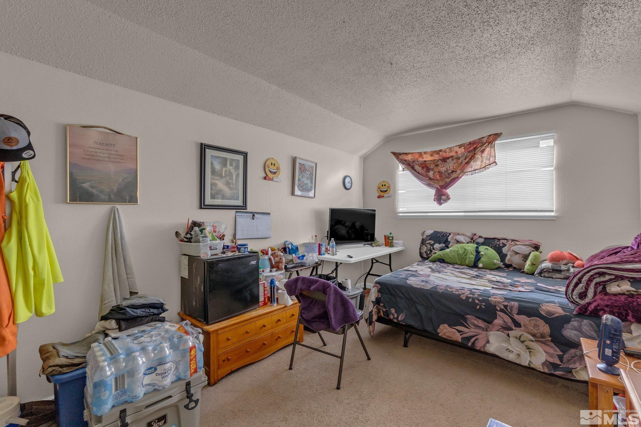 2265 Mannington Street Reno, NV 89512 - Photo 13 of 25 a bedroom with furniture and a flat screen tv