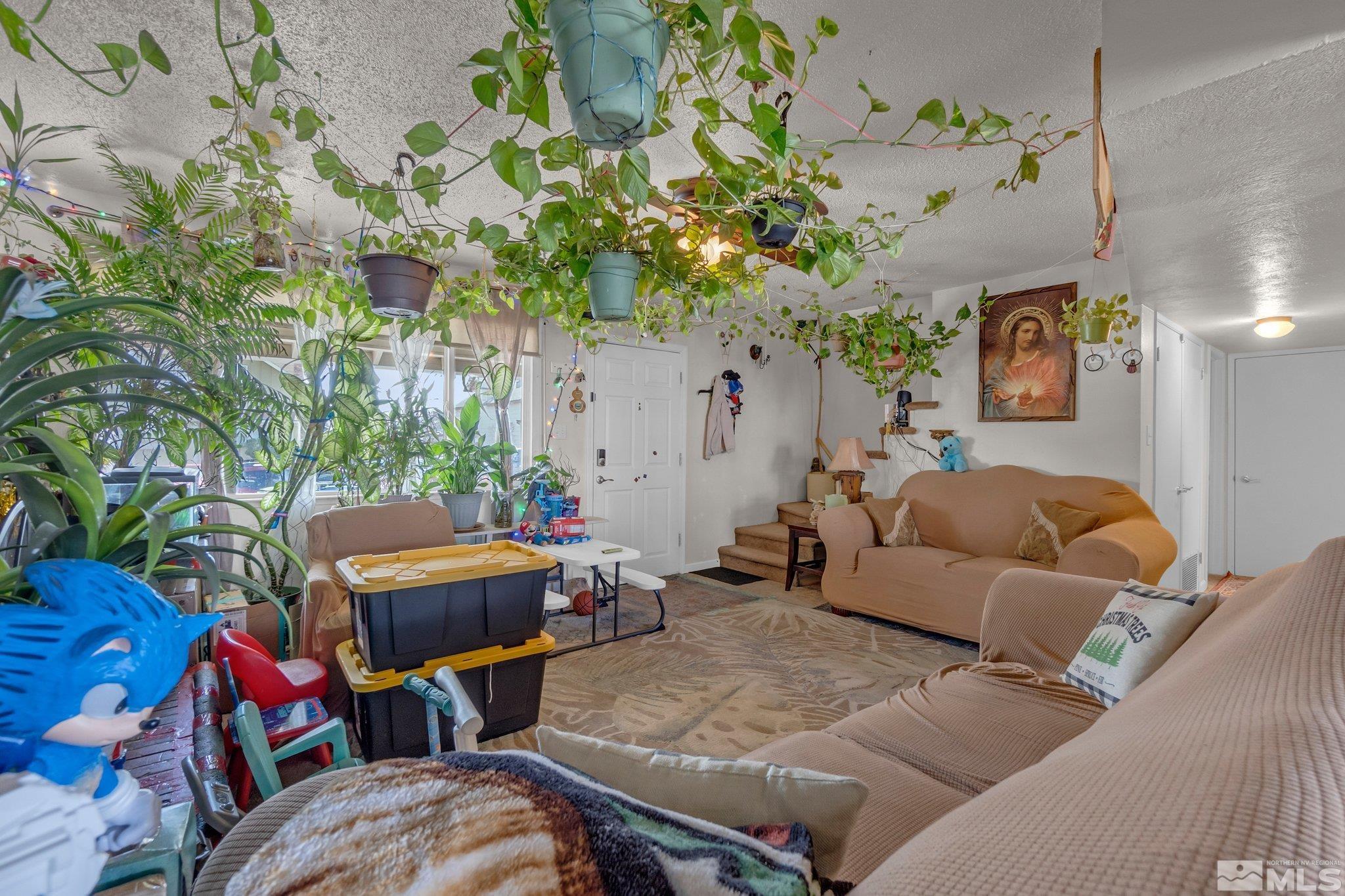 2265 Mannington Street Reno, NV 89512 - Photo 16 of 25 a outdoor living space with furniture and a potted plant