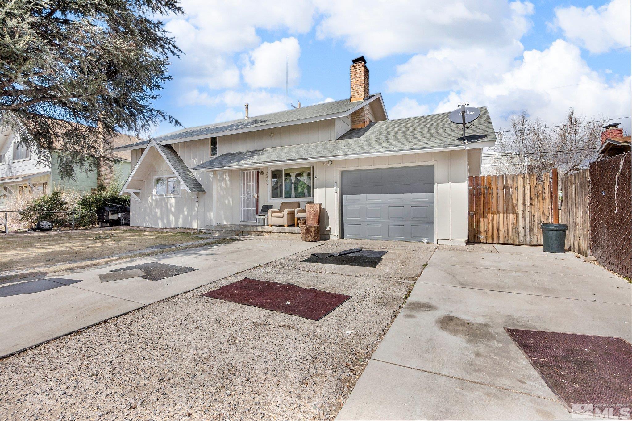 2265 Mannington Street Reno, NV 89512 - Photo 2 of 25 a front view of a house with yard
