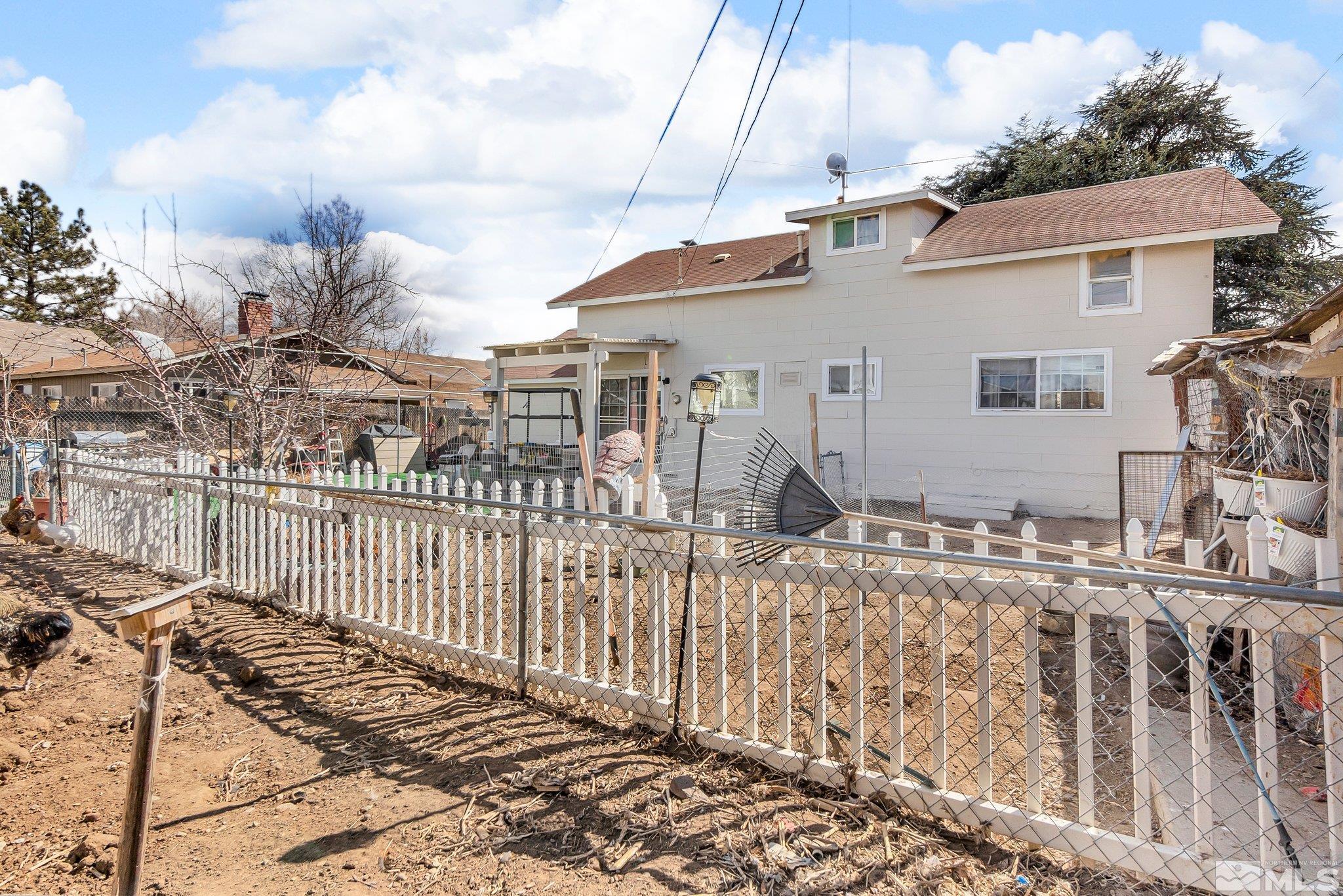 2265 Mannington Street Reno, NV 89512 - Photo 21 of 25 a view of a house with wooden fence