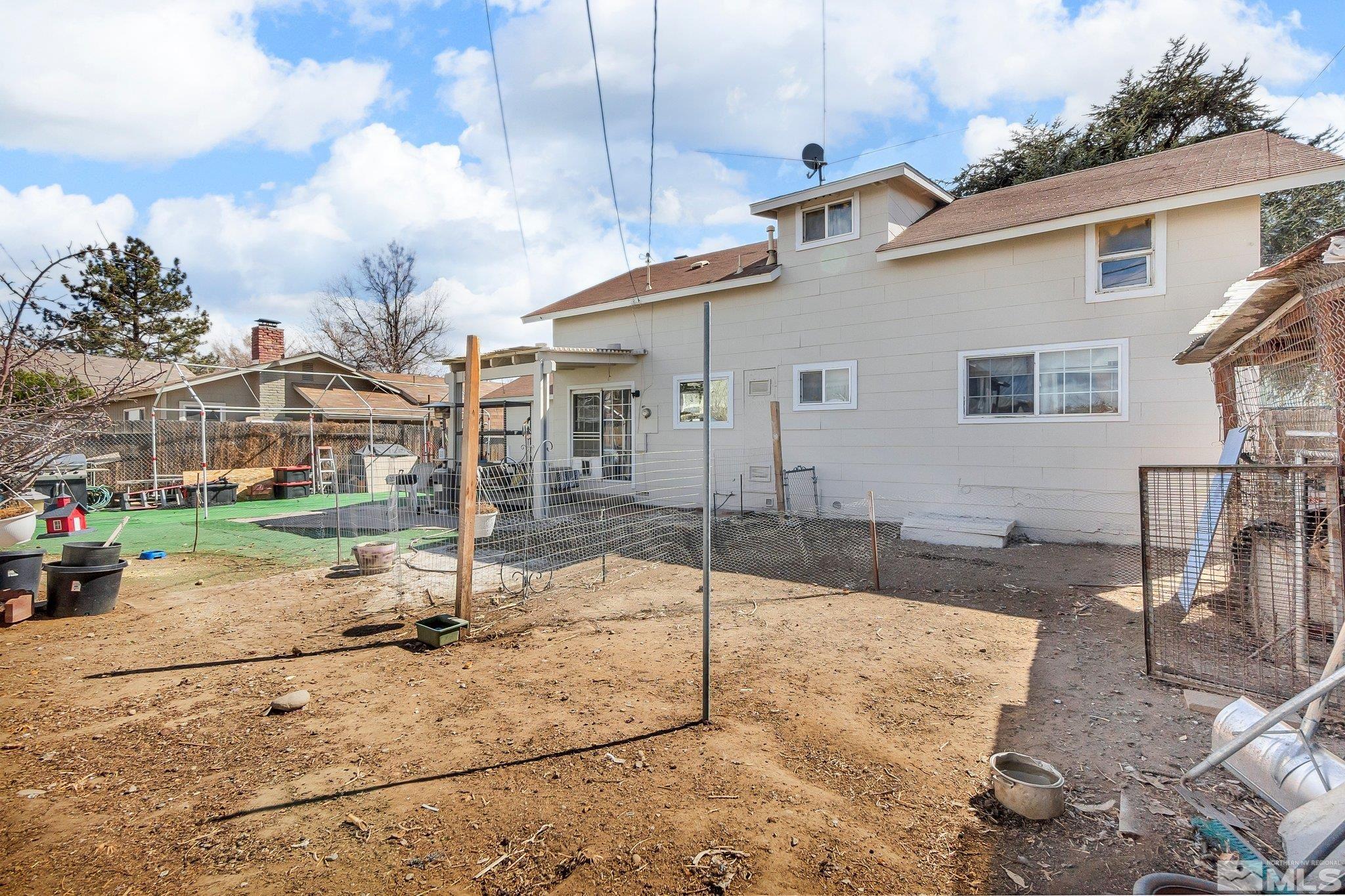 2265 Mannington Street Reno, NV 89512 - Photo 23 of 25 a view of a white house with wooden fence