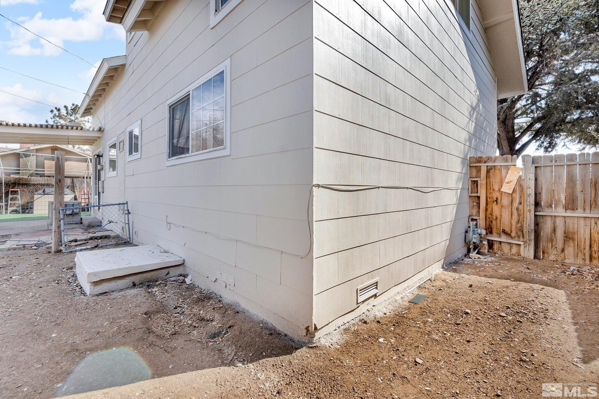 2265 Mannington Street Reno, NV 89512 - Photo 25 of 25 a view of house with backyard and wooden fence