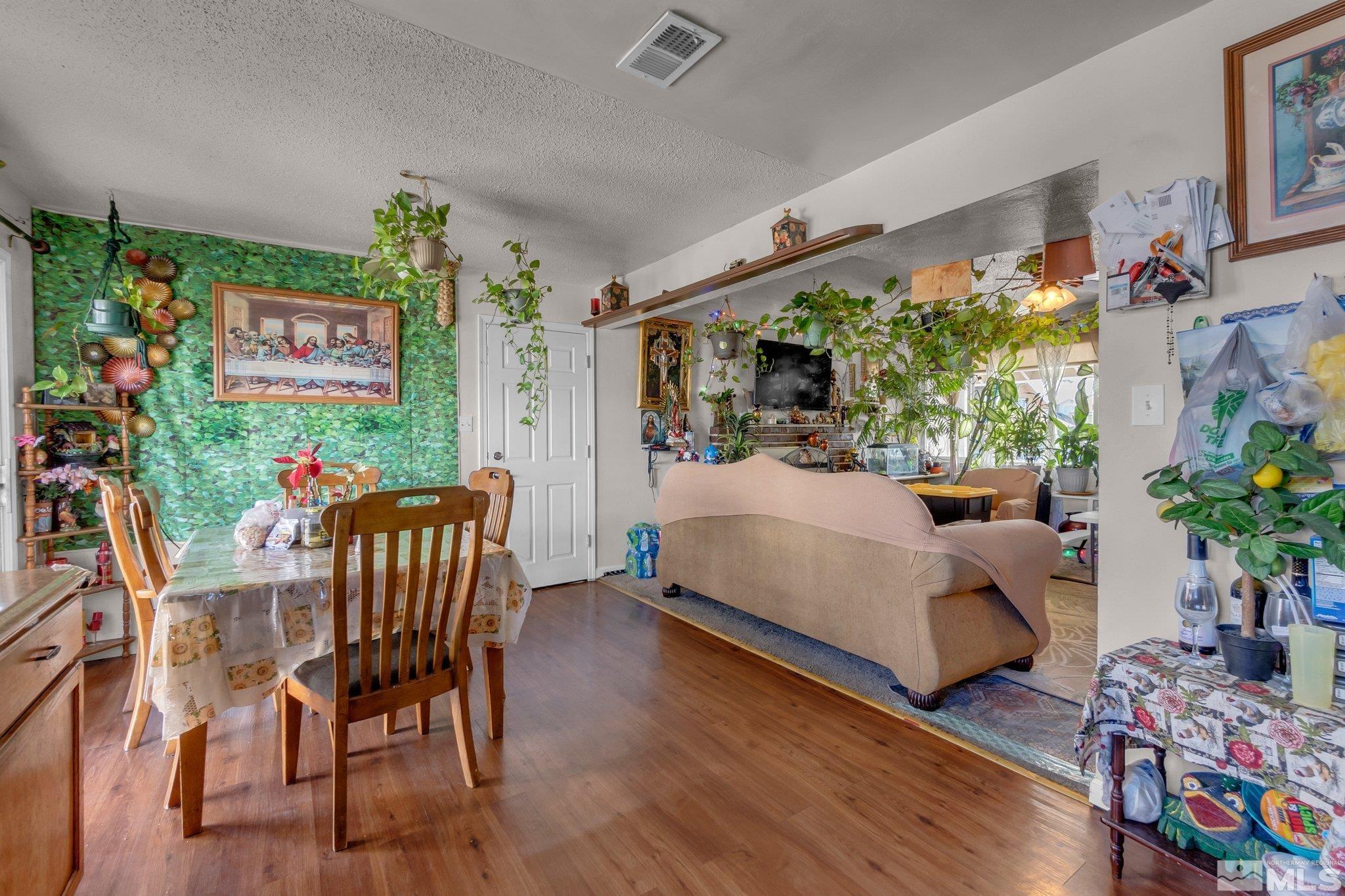 2265 Mannington Street Reno, NV 89512 - Photo 8 of 25 a living room filled with furniture and a potted plant