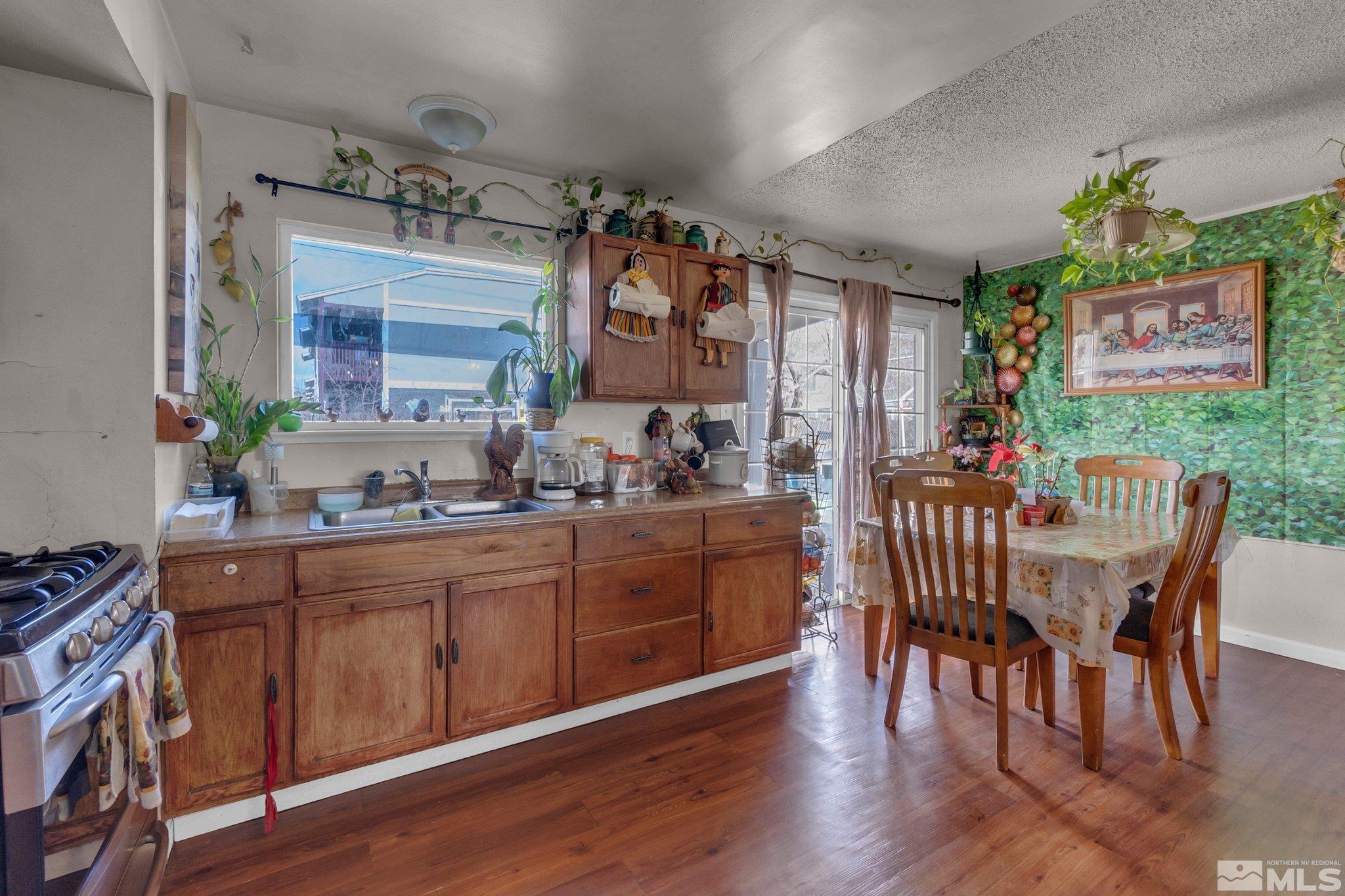 2265 Mannington Street Reno, NV 89512 - Photo 9 of 25 a view of a dining room with furniture window and wooden floor