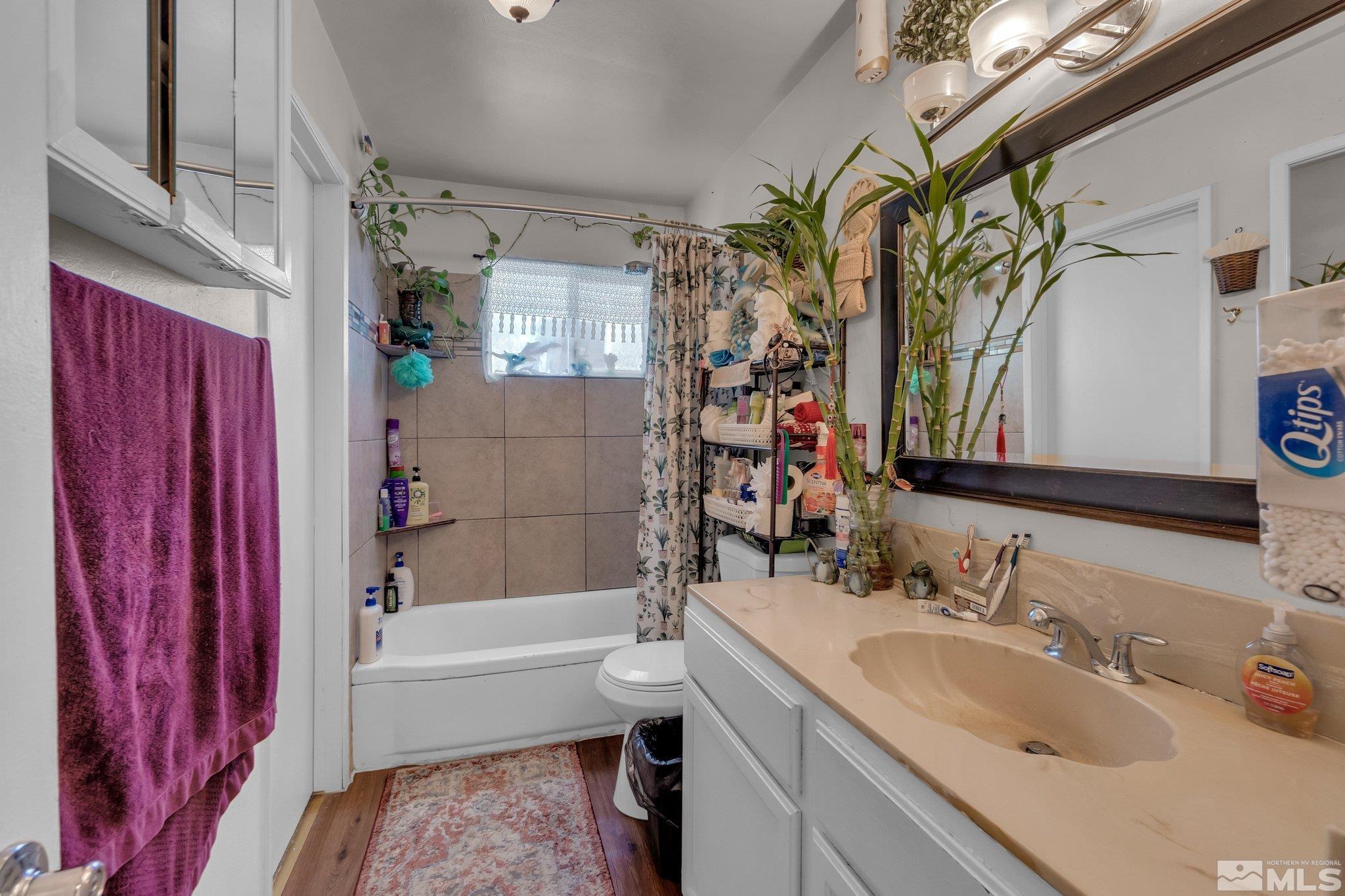 2265 Mannington Street Reno, NV 89512 - Photo 10 of 25 a bathroom with a sink a toilet and shower