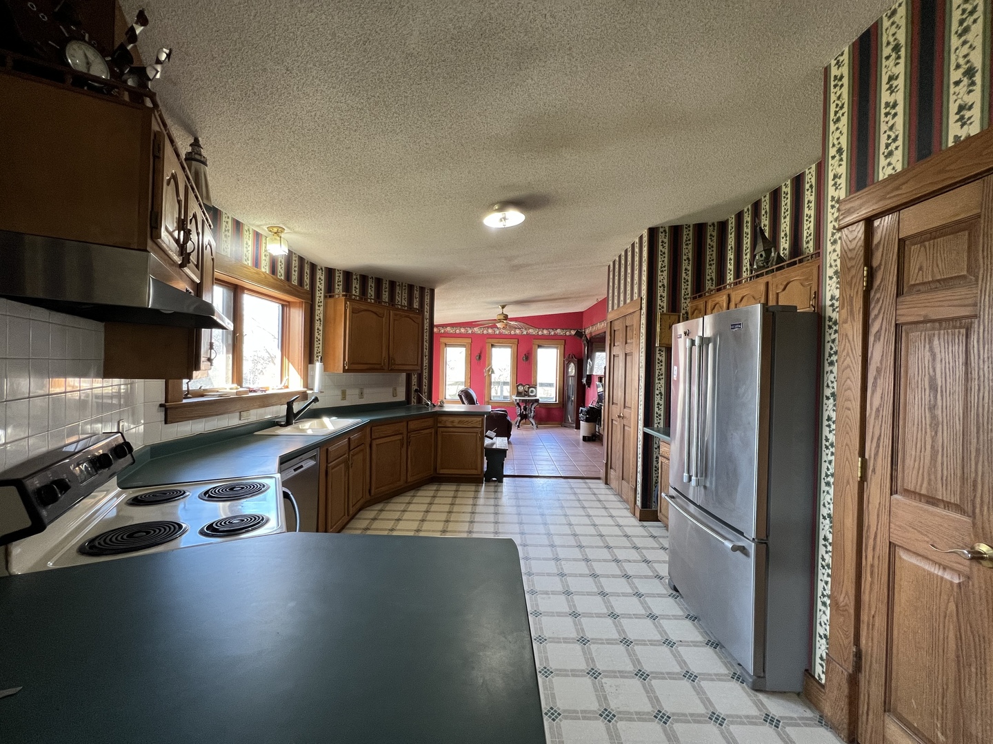 1451 Riverview Road Amboy, IL 61310 - Photo 30 of 60 a kitchen with lots of counter top space and stainless steel appliances