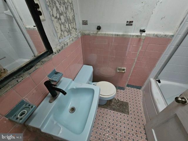 8305 Temple Road Philadelphia, PA 19150 - Photo 11 of 14 a bathroom with a toilet and a shower