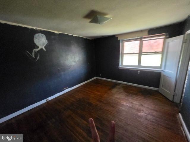 8305 Temple Road Philadelphia, PA 19150 - Photo 12 of 14 wooden floor in an empty room with a window
