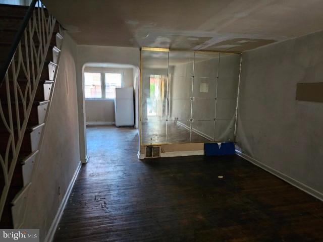 8305 Temple Road Philadelphia, PA 19150 - Photo 2 of 14 a view of a room with wooden floor and staircase