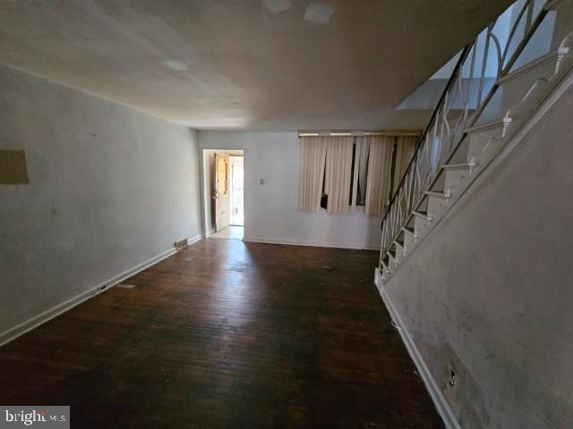 8305 Temple Road Philadelphia, PA 19150 - Photo 3 of 14 a view of a hallway with wooden floor and staircase