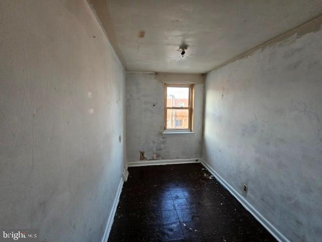 8305 Temple Road Philadelphia, PA 19150 - Photo 7 of 14 an empty room with wooden floor and windows